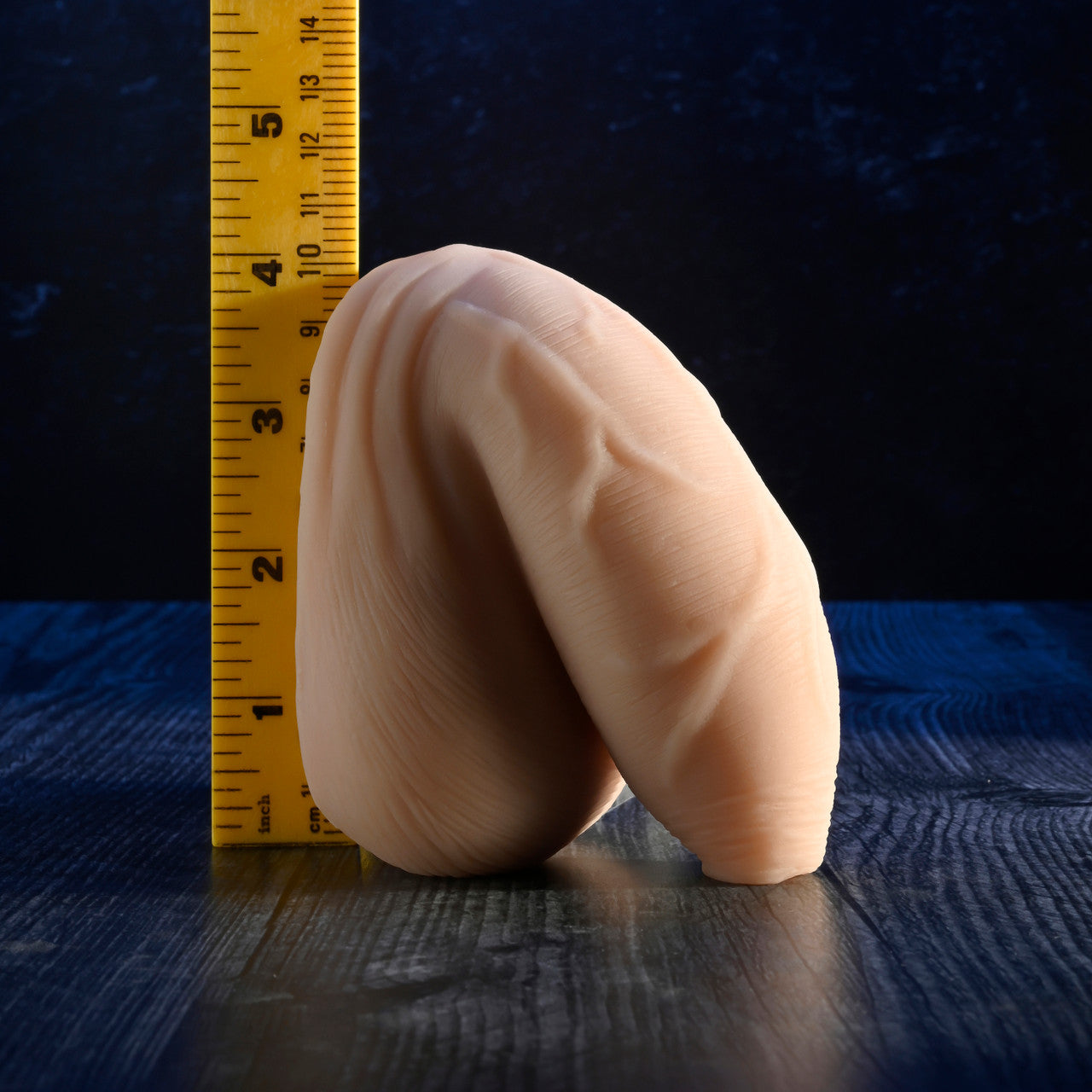 Uncircumcised packer made of soft, waterproof TPE, shown next to a ruler.