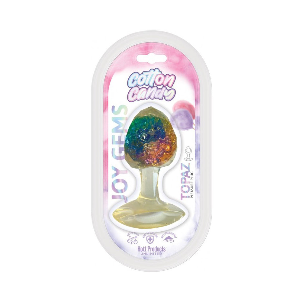 Joy Gems Topaz silicone butt plug in cotton candy packaging.