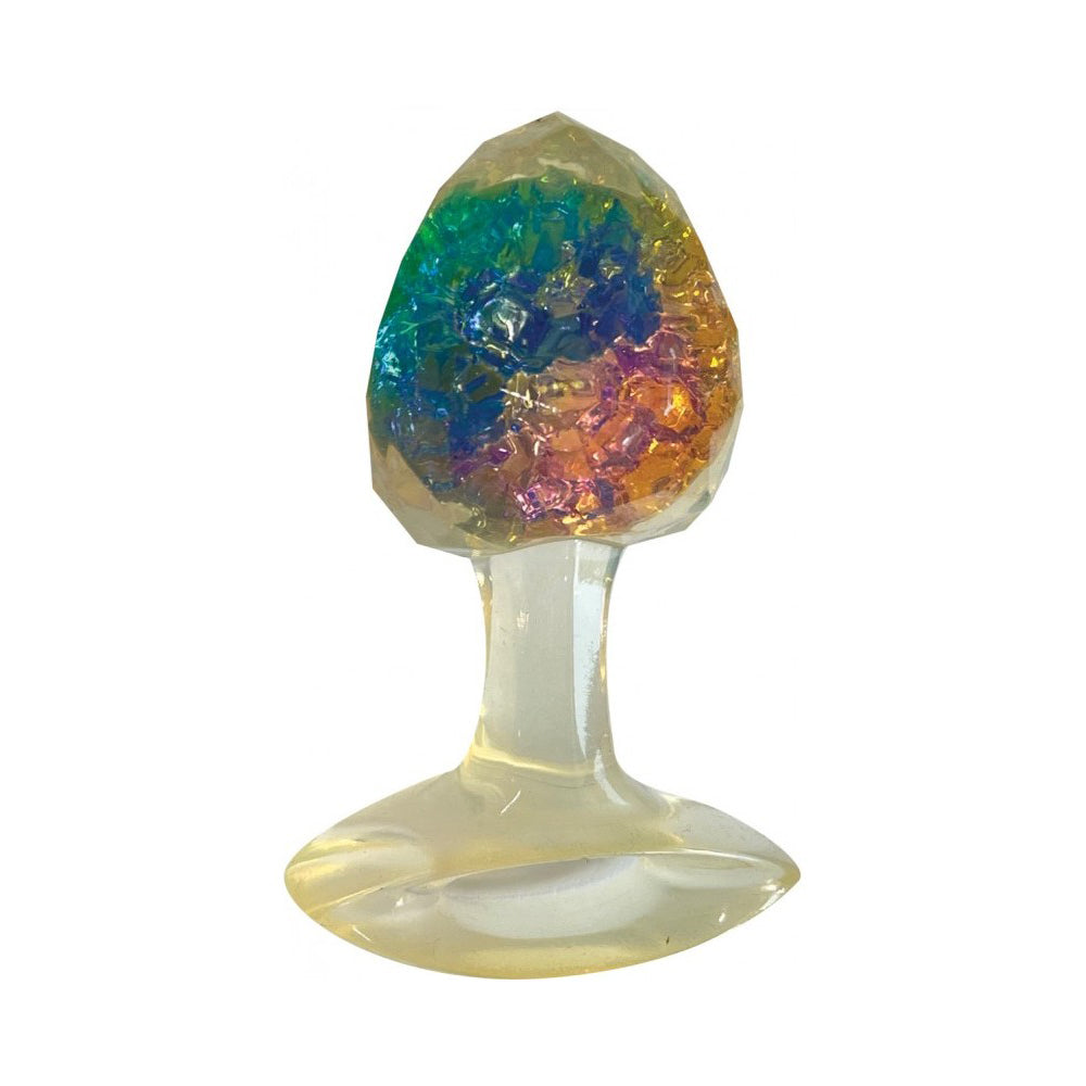 A clear silicone butt plug with a faceted, colorful gem-like top.