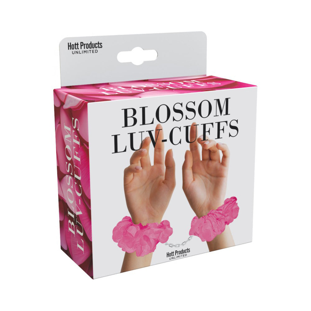 Soft pink plush handcuffs with a chain and keys on a product box.
