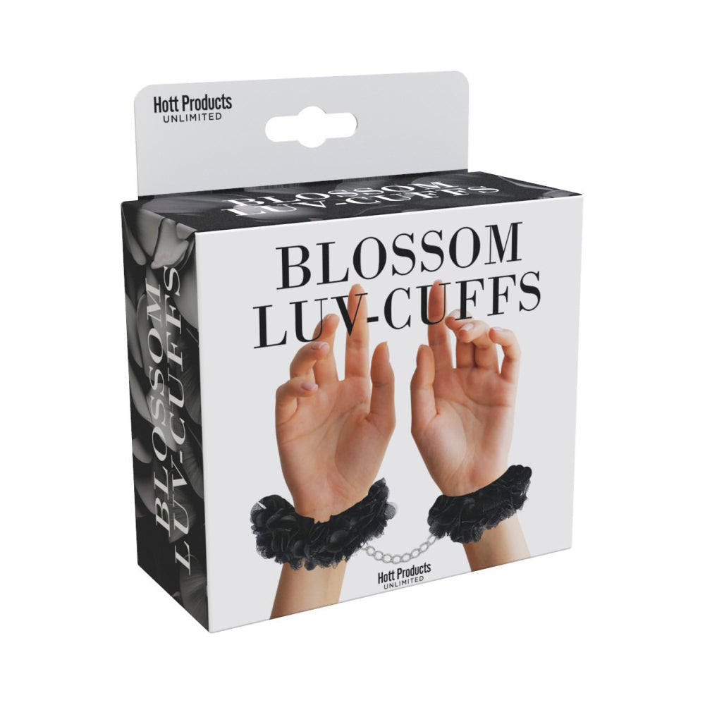 Black fabric handcuffs with a chain connecting them.