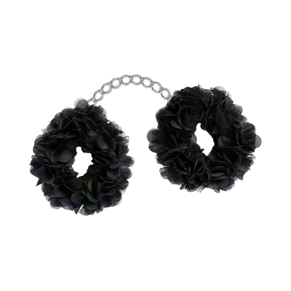 Black fabric handcuffs with a silver chain.