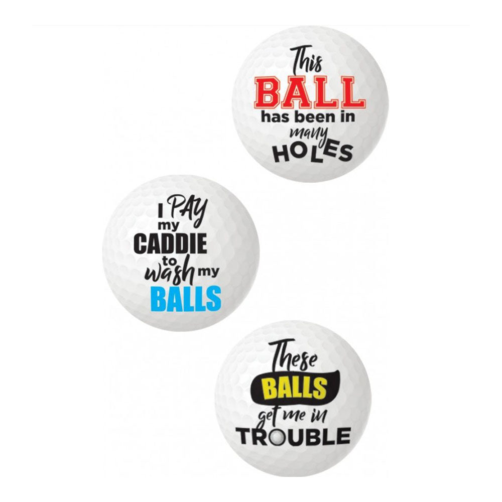 Three novelty golf balls with funny sayings.