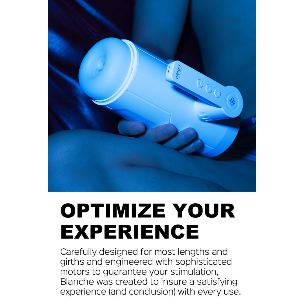 A white automatic male masturbator with a blue glow and control buttons.