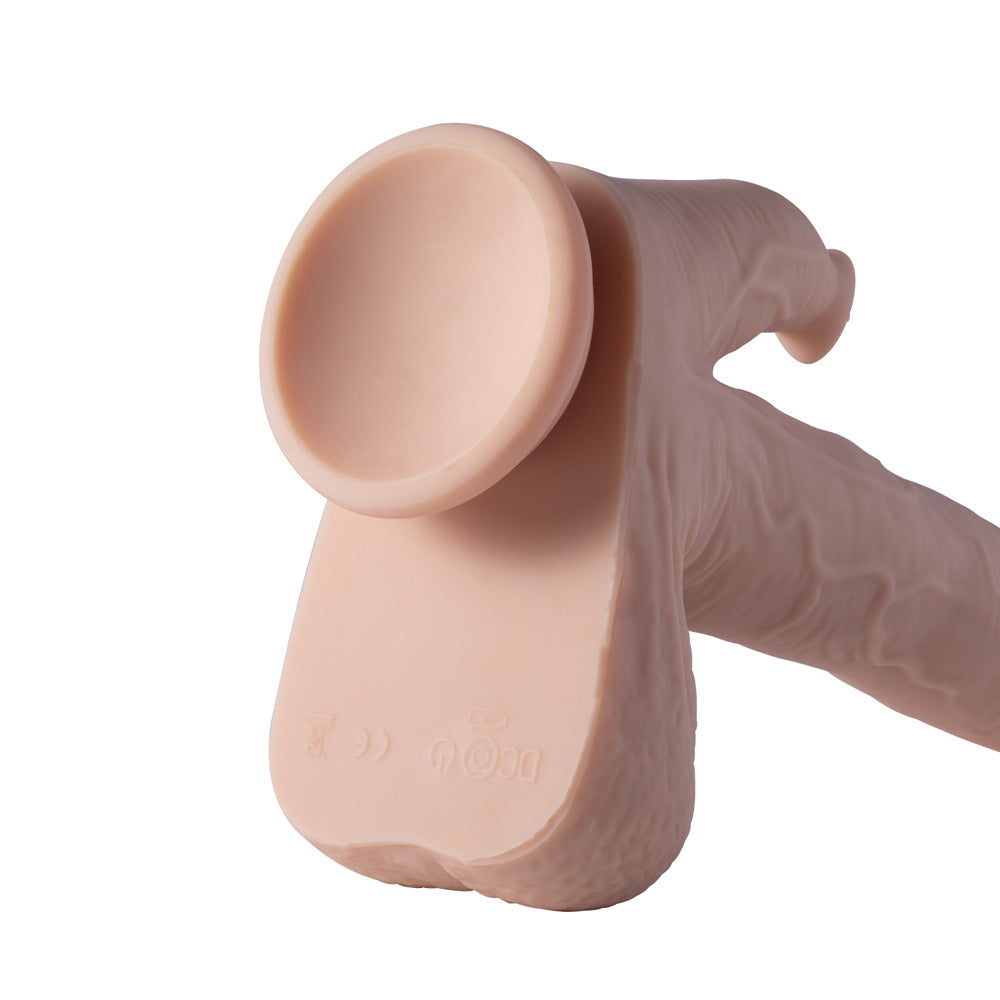Realistic dildo with suction cup base and textured shaft.