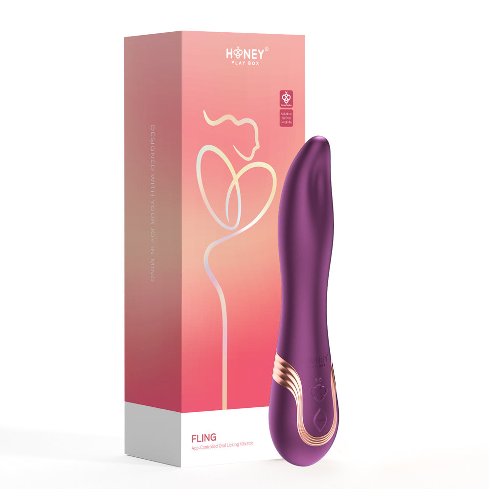 A purple silicone app-controlled licking vibrator with gold accents next to its pink and orange box.