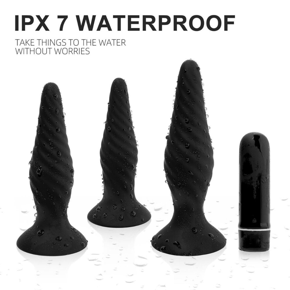 Black anal plugs and a bullet vibrator with water droplets.
