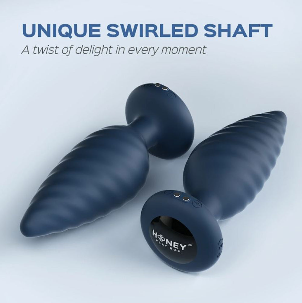 App-controlled vibrating anal plug with a swirled shaft.