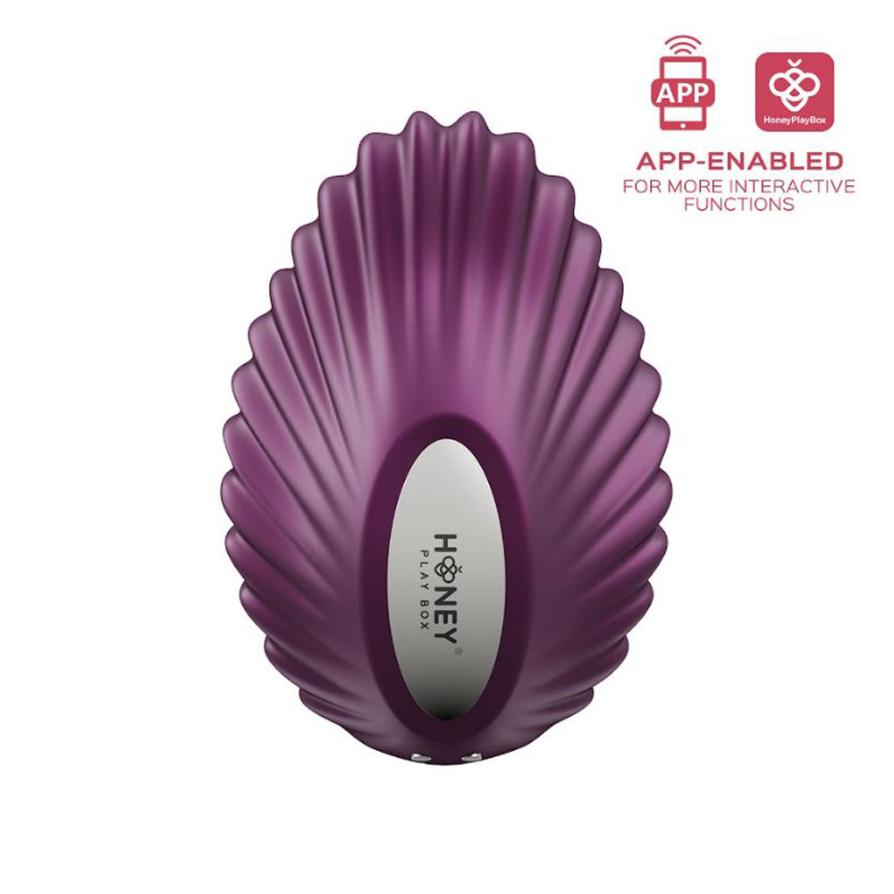 Purple app-enabled magnetic panty vibrator with a shell design.