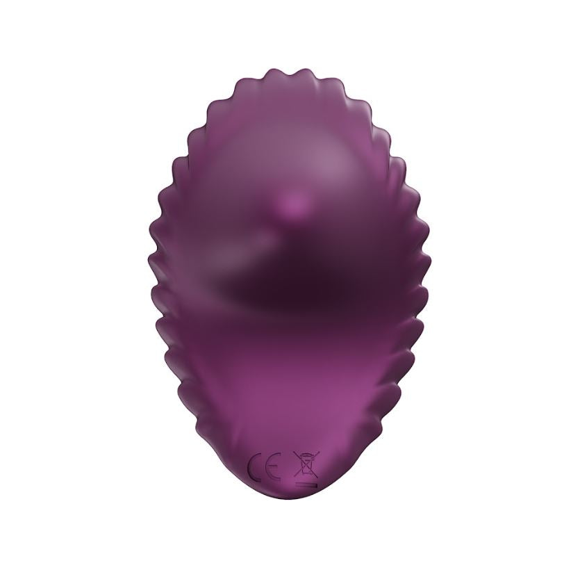 Purple shell-shaped vibrator with a wavy edge and CE marking.