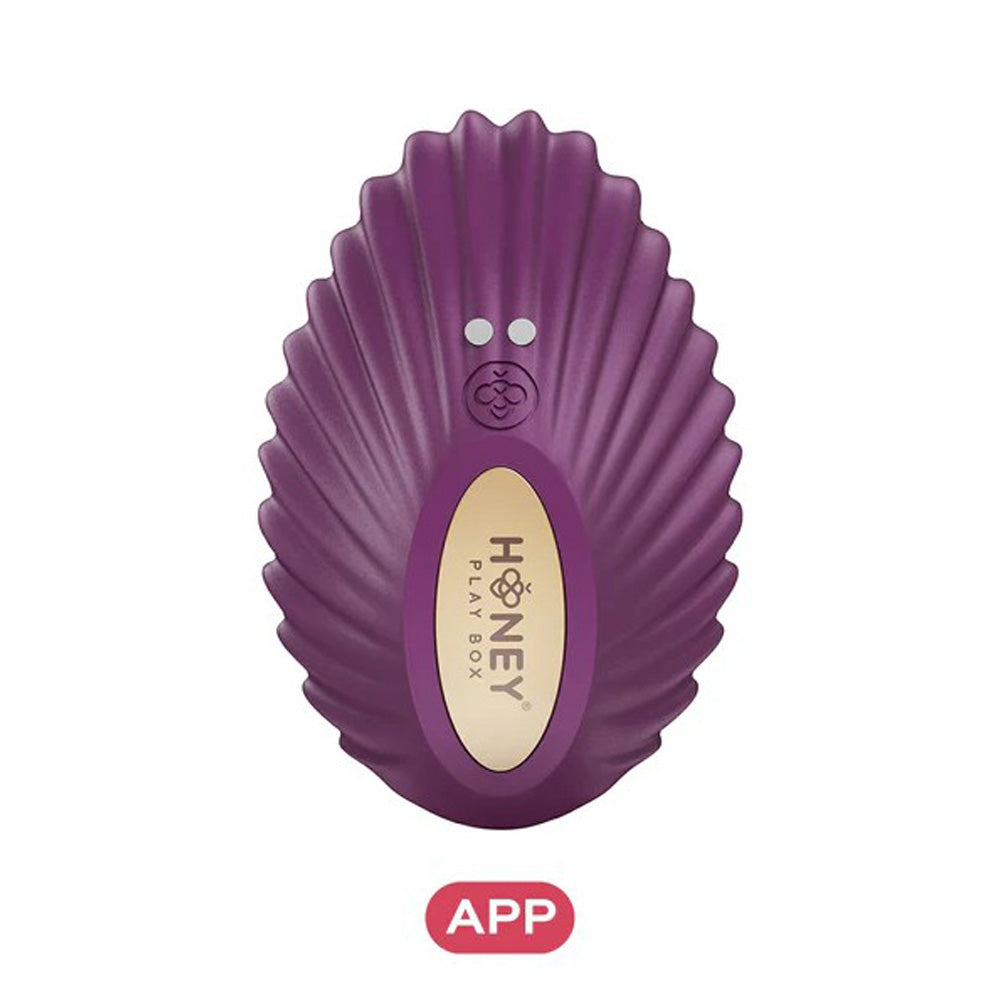 Purple app-controlled panty vibrator with a shell-like design and gold accent.