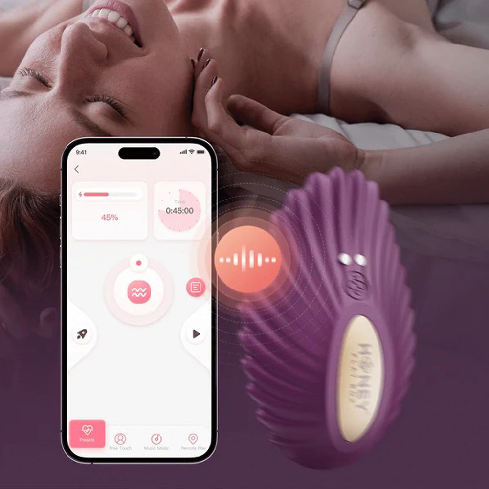Purple app-controlled panty vibrator with a phone interface.