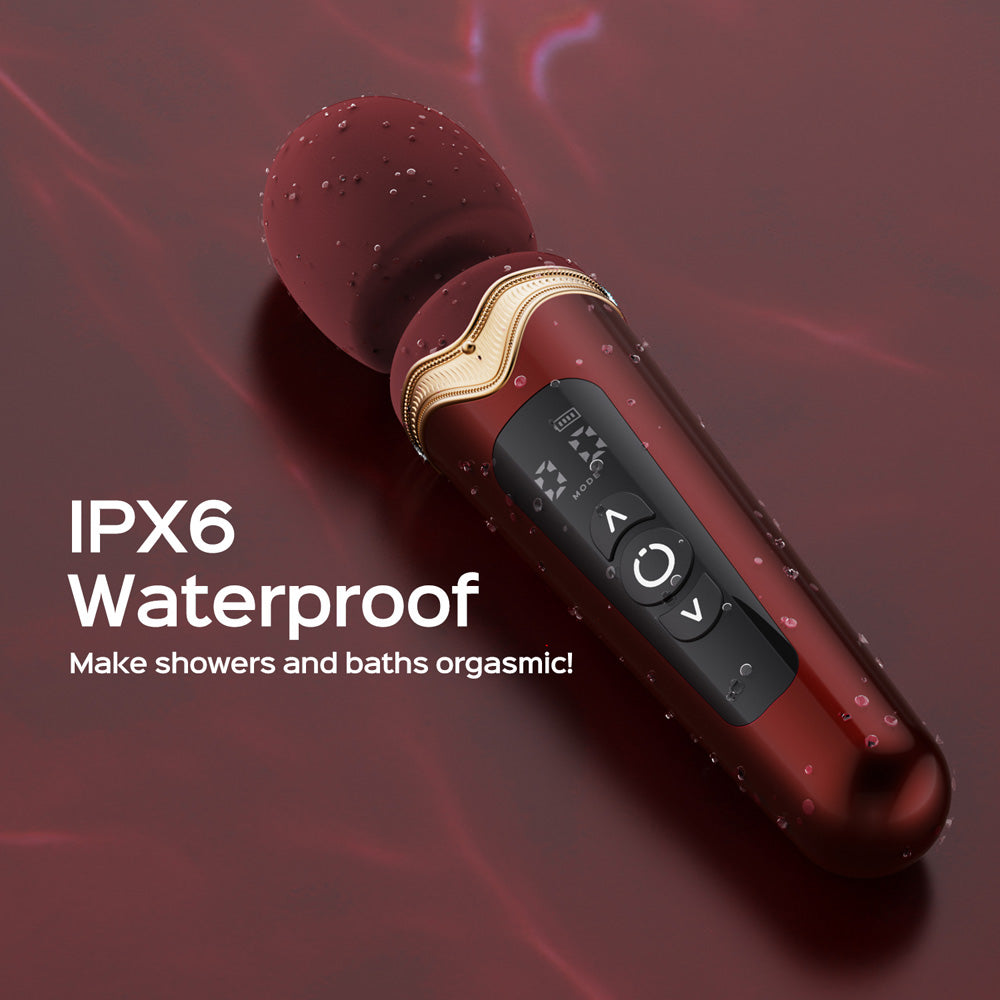 A red heating wand with a digital display and buttons, shown with water droplets.