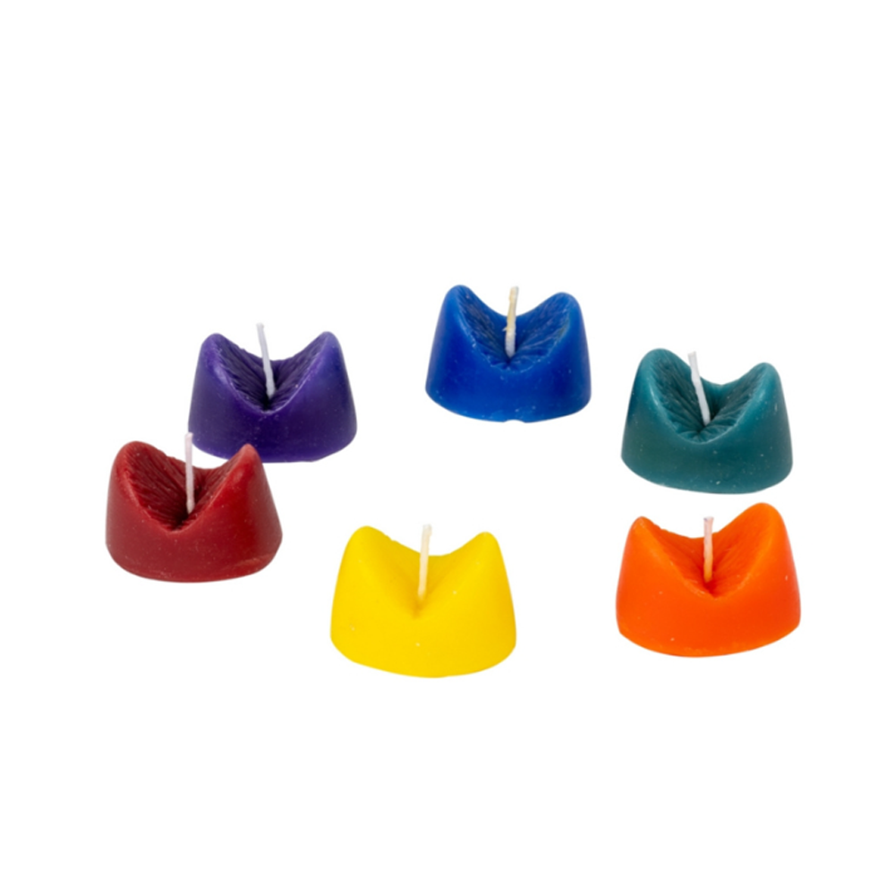 Six rainbow anus-shaped scented candles in various colors.