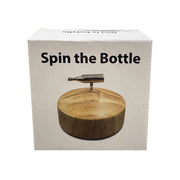 Spin the Bottle party game with a metal bottle and wooden base.