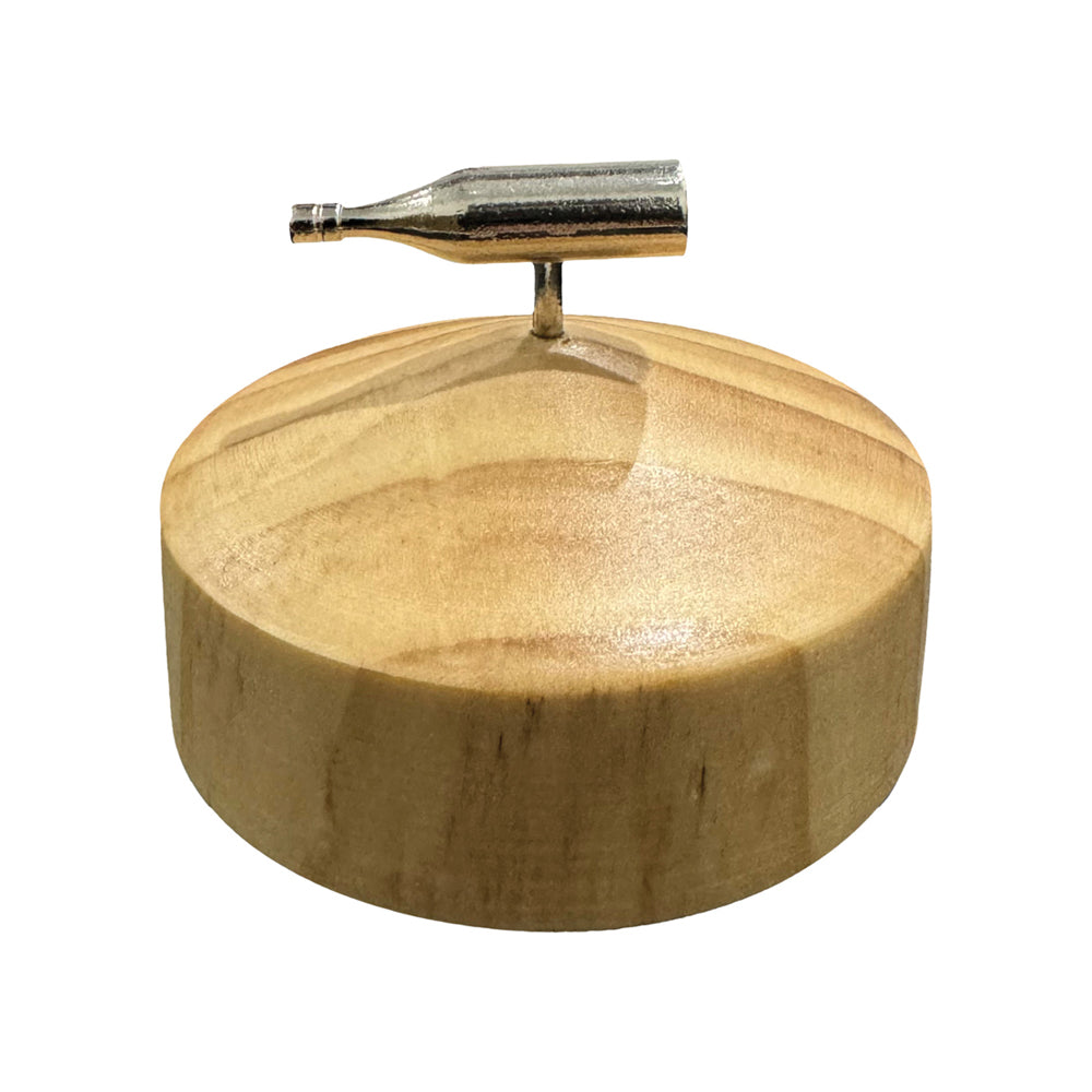 Spin the bottle party game with a metal bottle and wooden base.