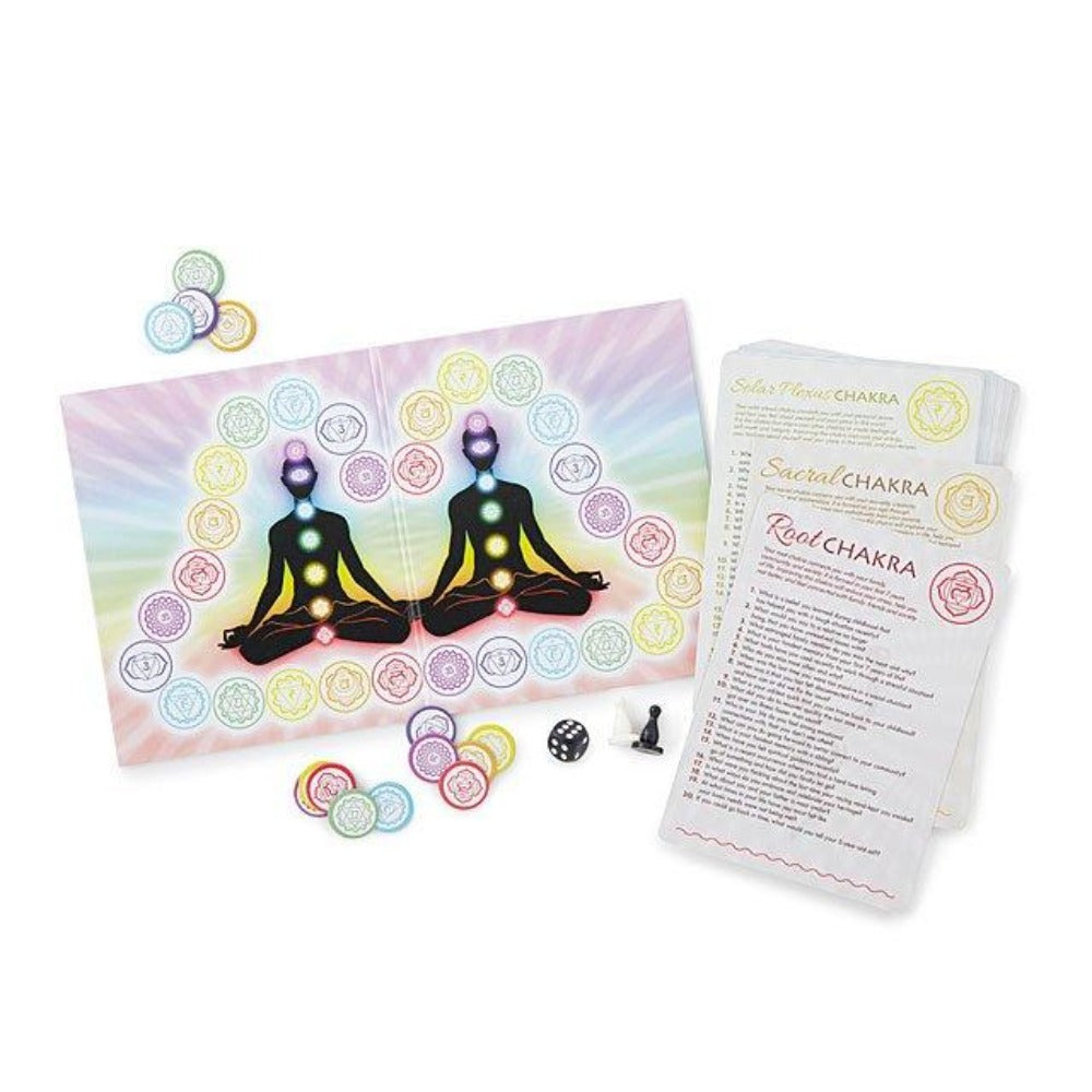 Chakra-themed board game with cards, tokens, and a die for couples.