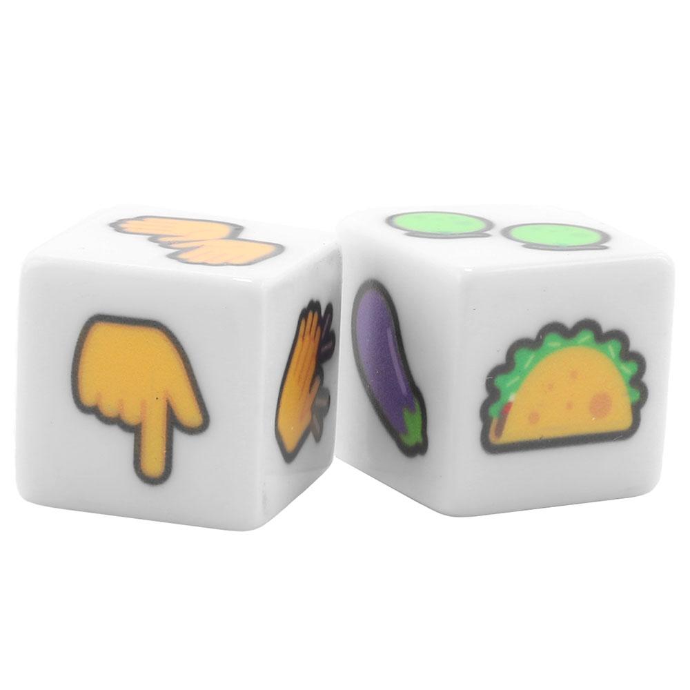 Two white dice with emoji symbols including a pointing finger, eggplant, and taco.