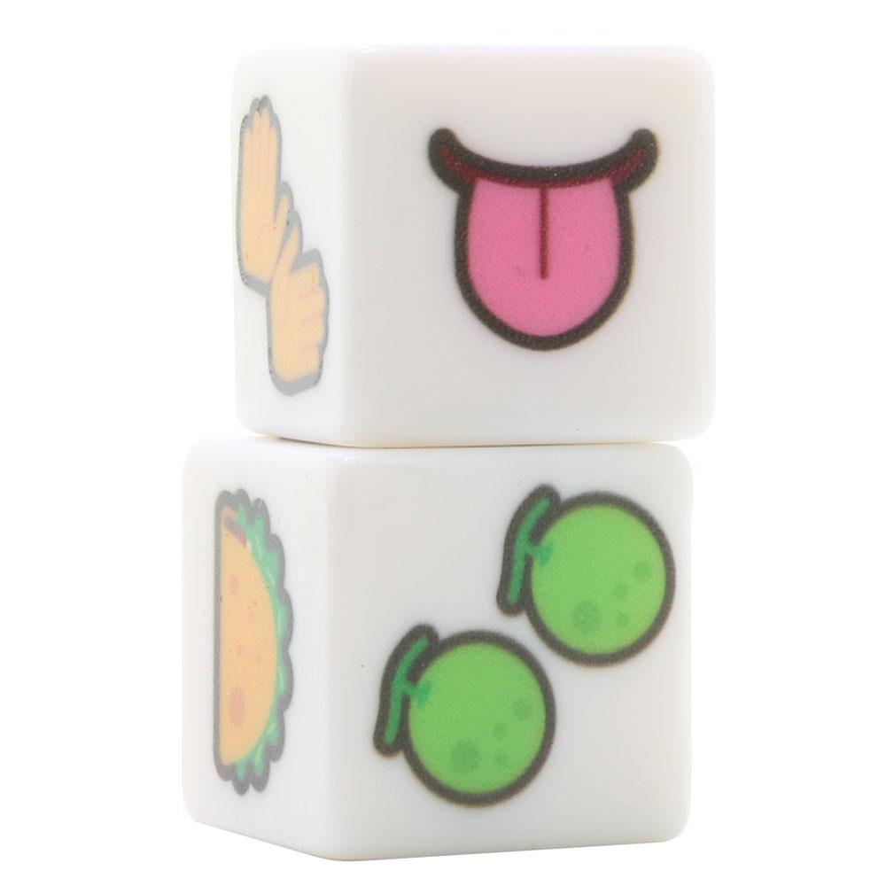 Two white dice with emoji faces: a tongue, hands, a taco, and two limes.