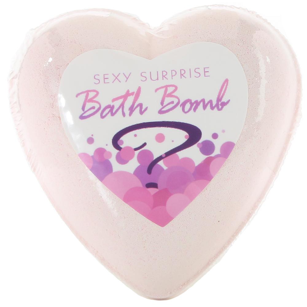 Pink heart-shaped bath bomb with "Sexy Surprise Bath Bomb" label.