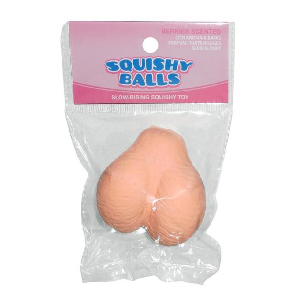 A peach-colored, scrotum-shaped squishy toy in packaging.