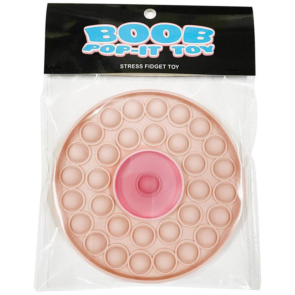 A pink, circular pop-it fidget toy with a nipple-like center, packaged in plastic.