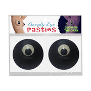 Glow in the dark googly eye pasties with black adhesive circles.