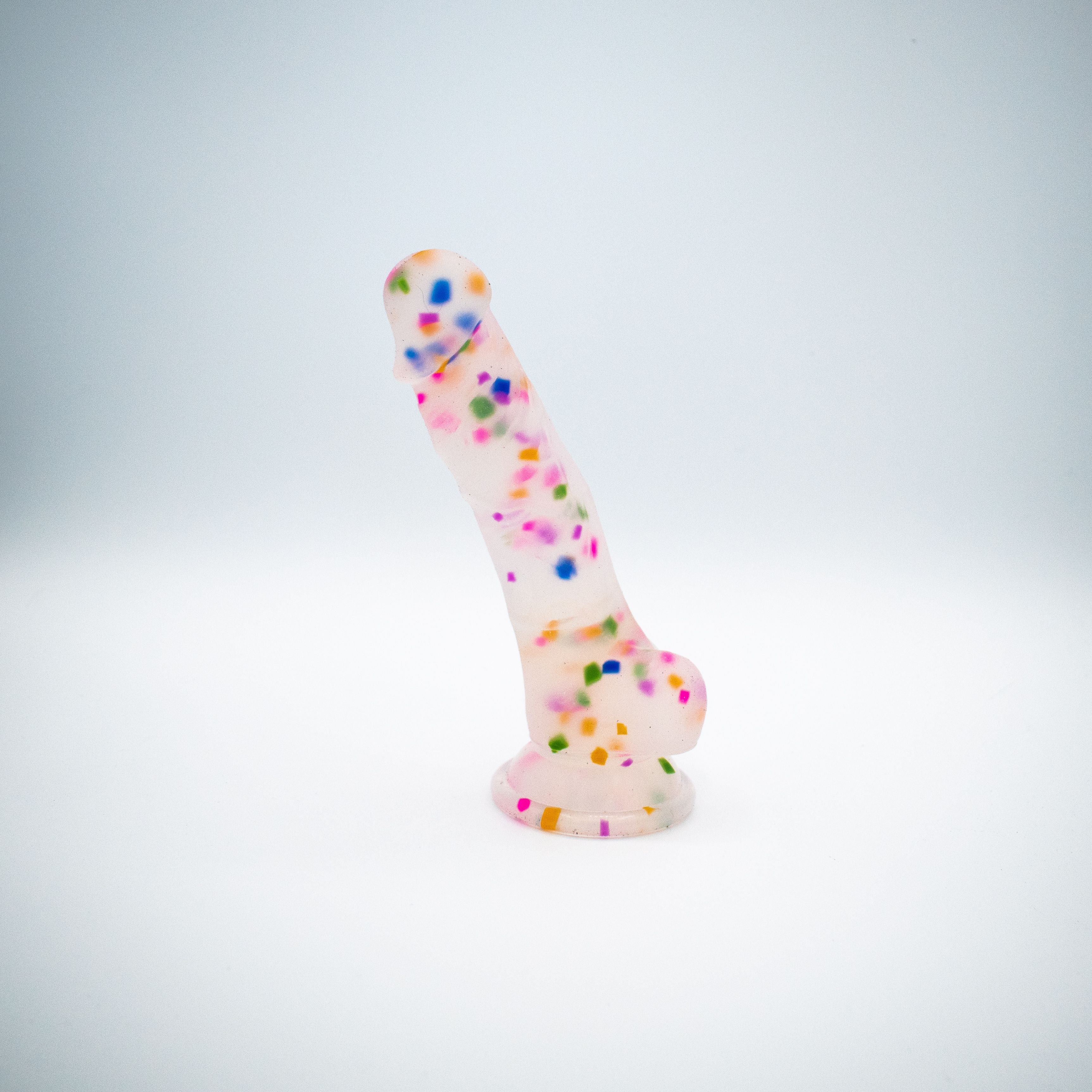 Confetti silicone dildo with suction cup base.