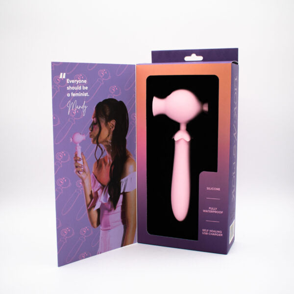 Pink dual motor tongue flicker toy with a woman on the packaging.