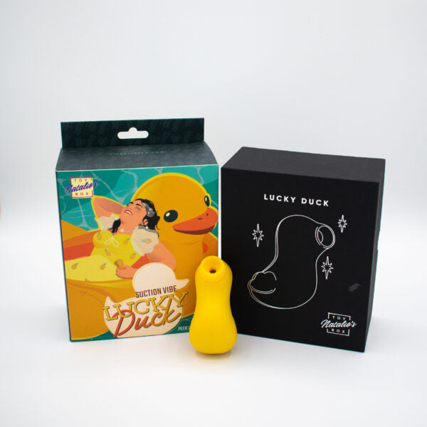 Yellow silicone suction stimulator in packaging with a duck design.