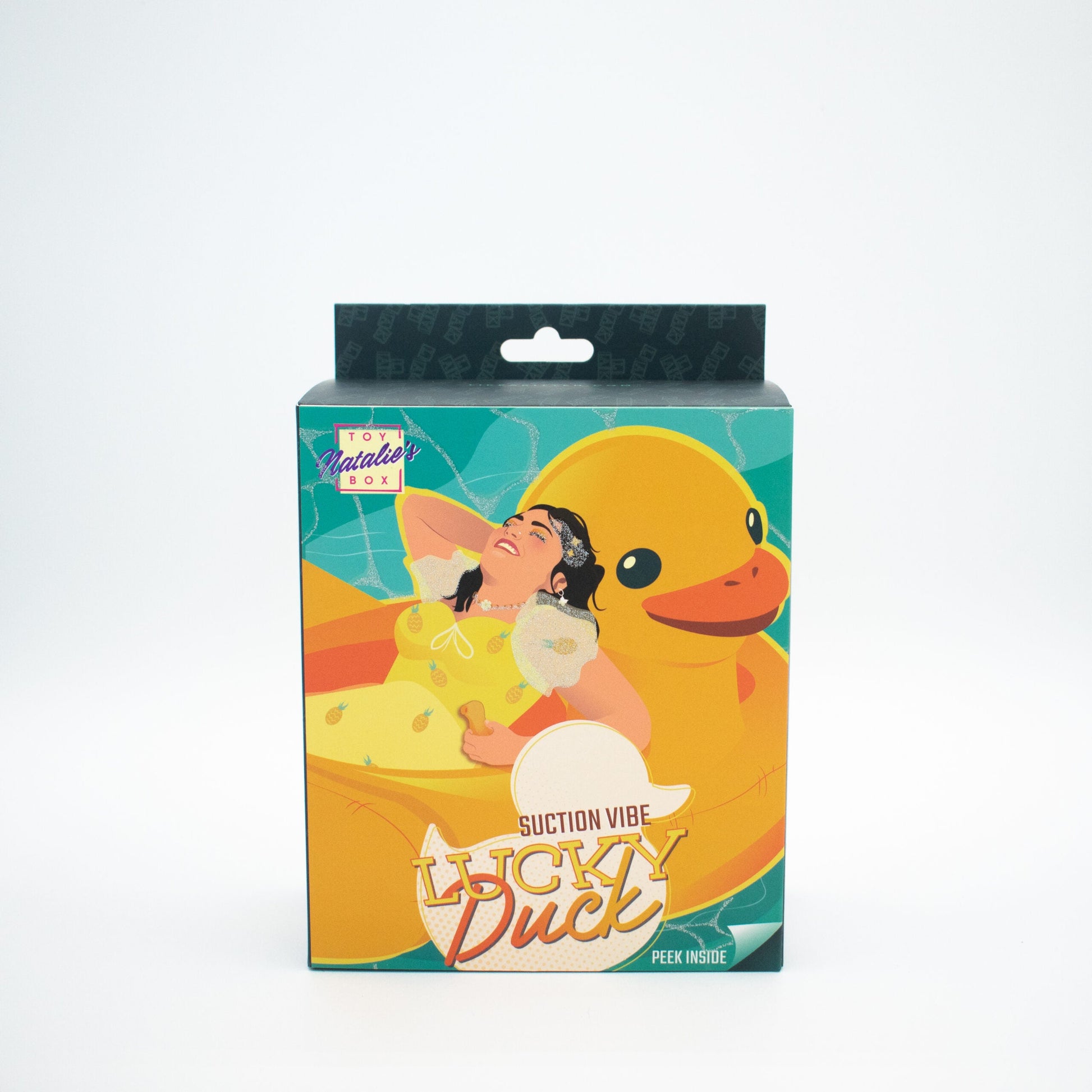A box for the Lucky Duck suction vibe featuring a woman relaxing on a giant rubber duck.