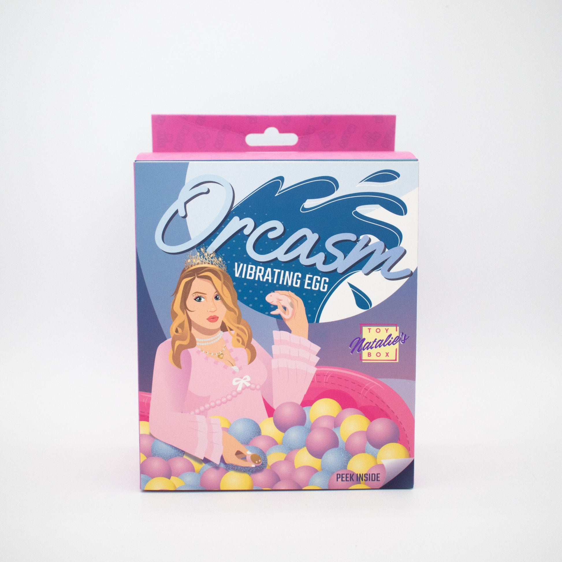 A box for a vibrating egg with a woman in a pink dress holding a small egg.
