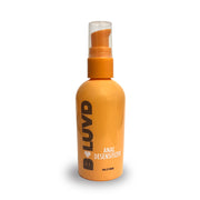 Orange bottle of anal desensitizing lubricant with a pump dispenser.