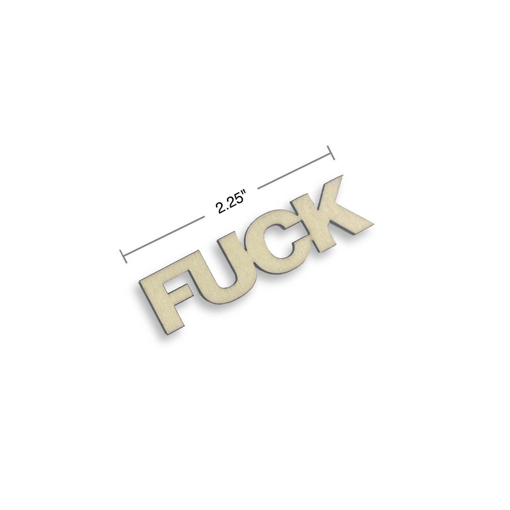 Wooden letters spelling "FUCK" with a 2.25 inch measurement line.
