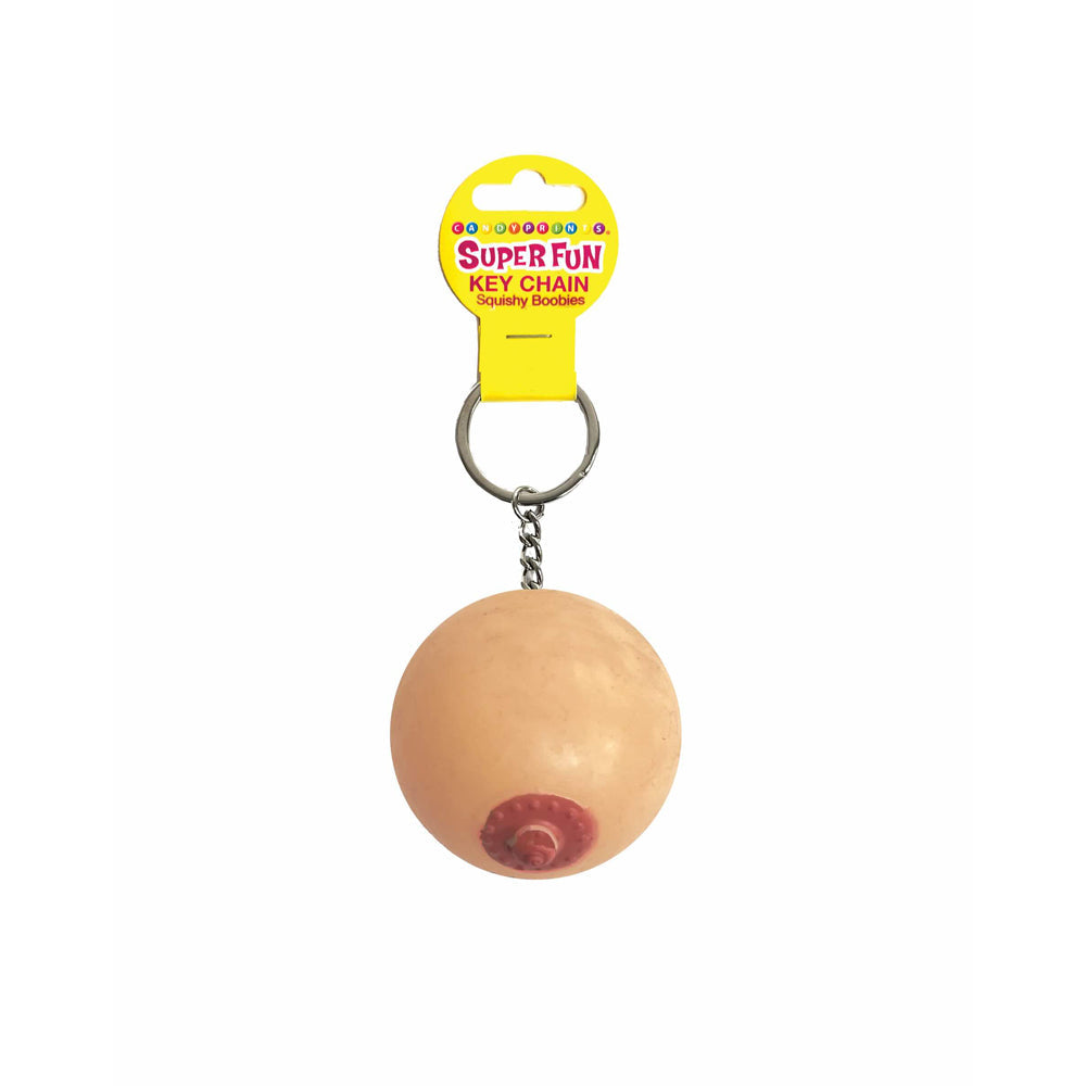 A novelty keychain shaped like a squishy boob with a pink nipple.
