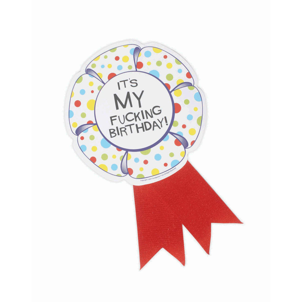 A round, polka-dotted birthday ribbon medallion with a red ribbon tail and the message "IT'S MY FUCKING BIRTHDAY!".