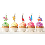 Five novelty candles depicting sexual positions on cupcakes.