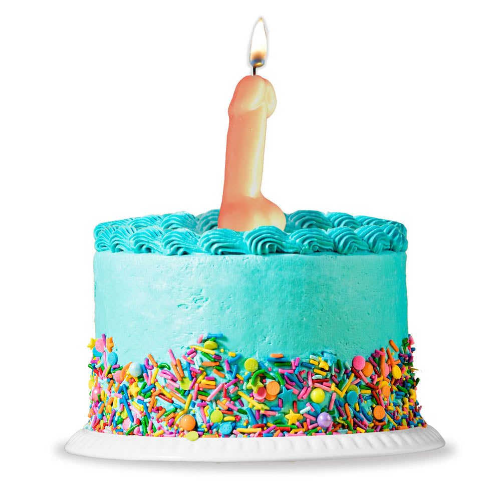 A novelty penis-shaped birthday candle on a teal cake with sprinkles.