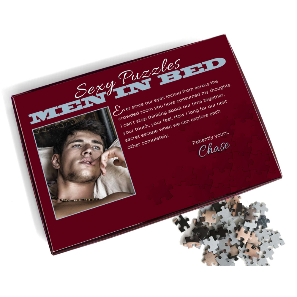 A 1000-piece jigsaw puzzle featuring a man in bed with text that reads "Sexy Puzzles MEN IN BED".