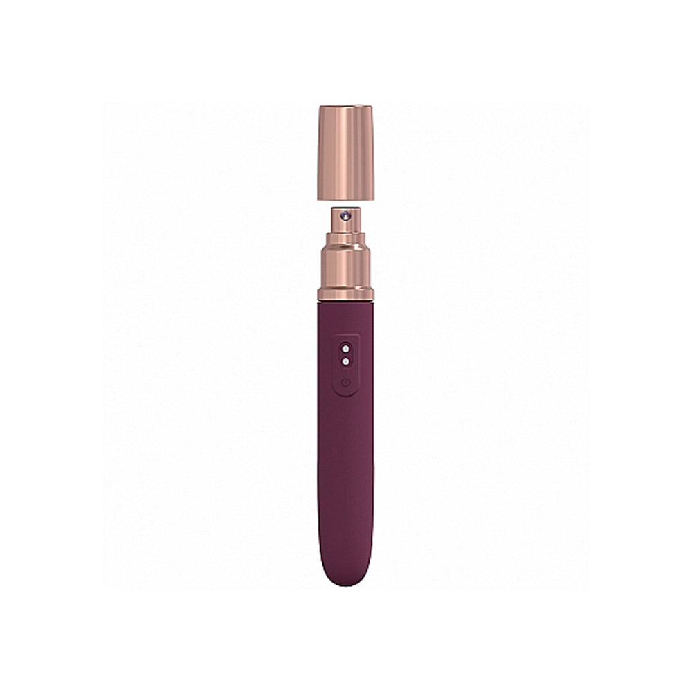 Burgundy rechargeable vibrator with rose gold cap and controls.