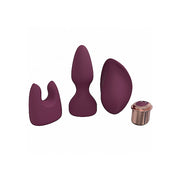 Burgundy silicone vibrator kit with three attachments and a charging base.