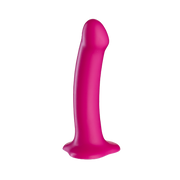 Pink silicone dildo with suction base, long and curved for strap-on play.