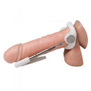 Penis extender device with white plastic ring, metal rod, and comfort strap on a model.