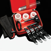 Red case with penis enlargement device, straps, and accessories.