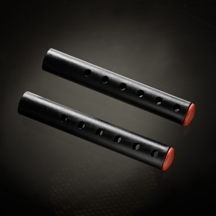 Two black penis enlargement rods with red caps and holes.