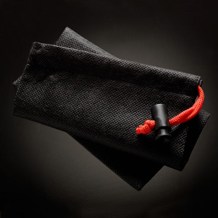 Black drawstring pouch with red cord and black stopper.