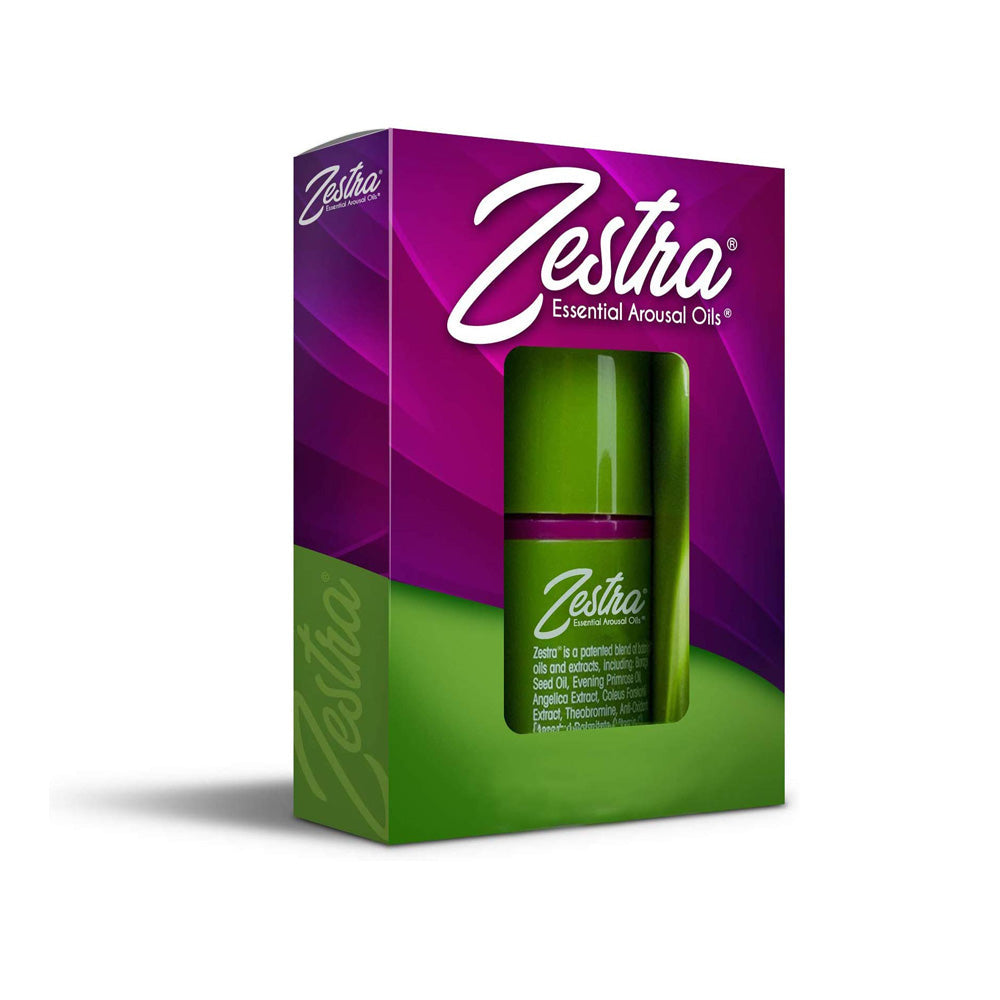 Zestra Essential Arousal Oil for Women in a green bottle with purple packaging.