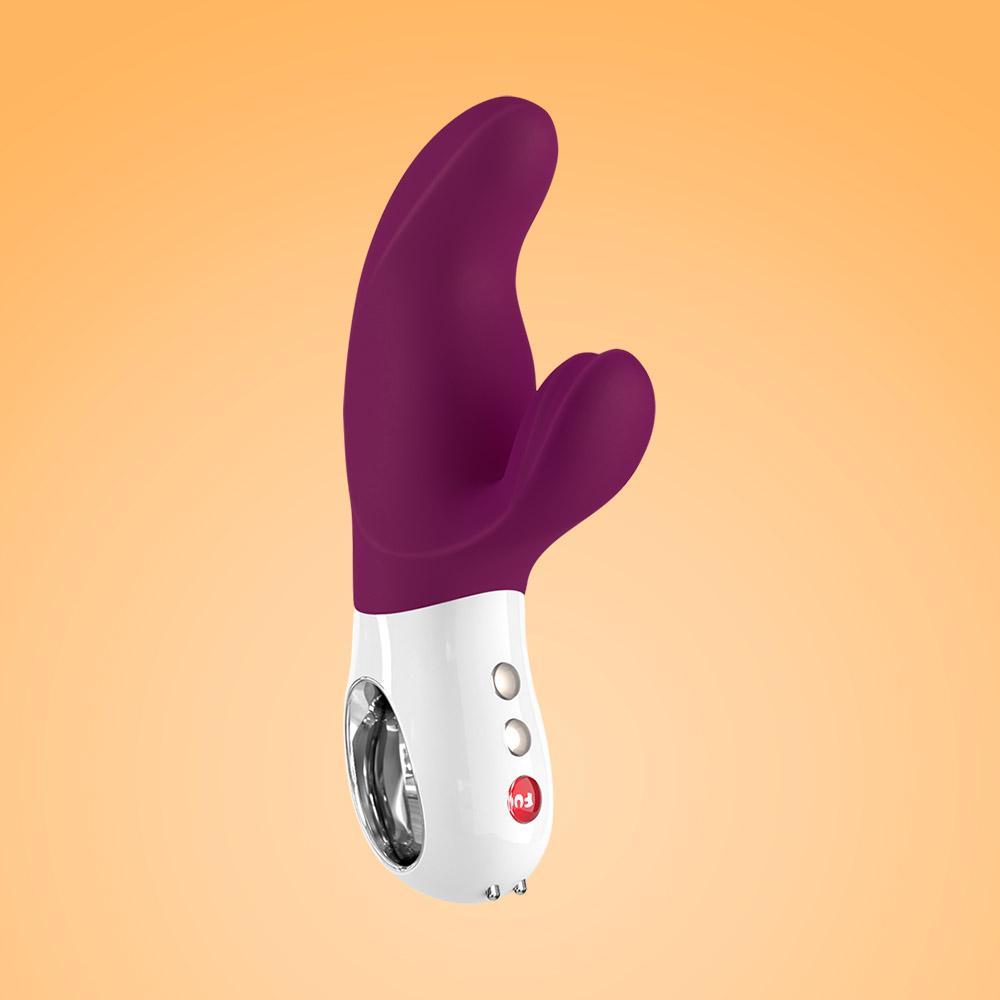 Purple and white dual motor rabbit vibrator with two buttons and a charging port.