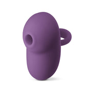 A dark purple silicone clitoral stimulator with a finger loop.
