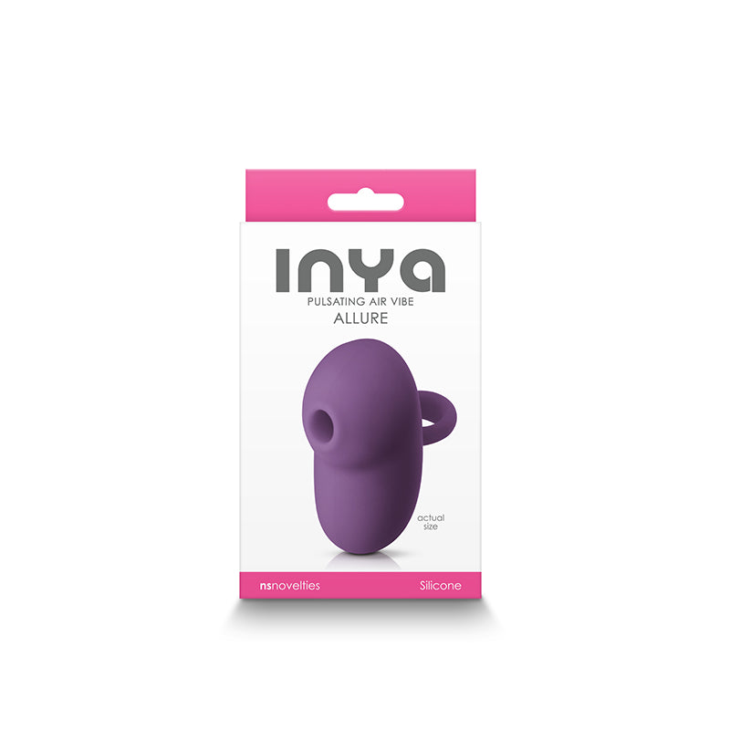 Dark purple silicone clitoral stimulator in its packaging.